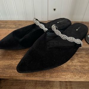 Black velvety Birdies mules with embellished strap.